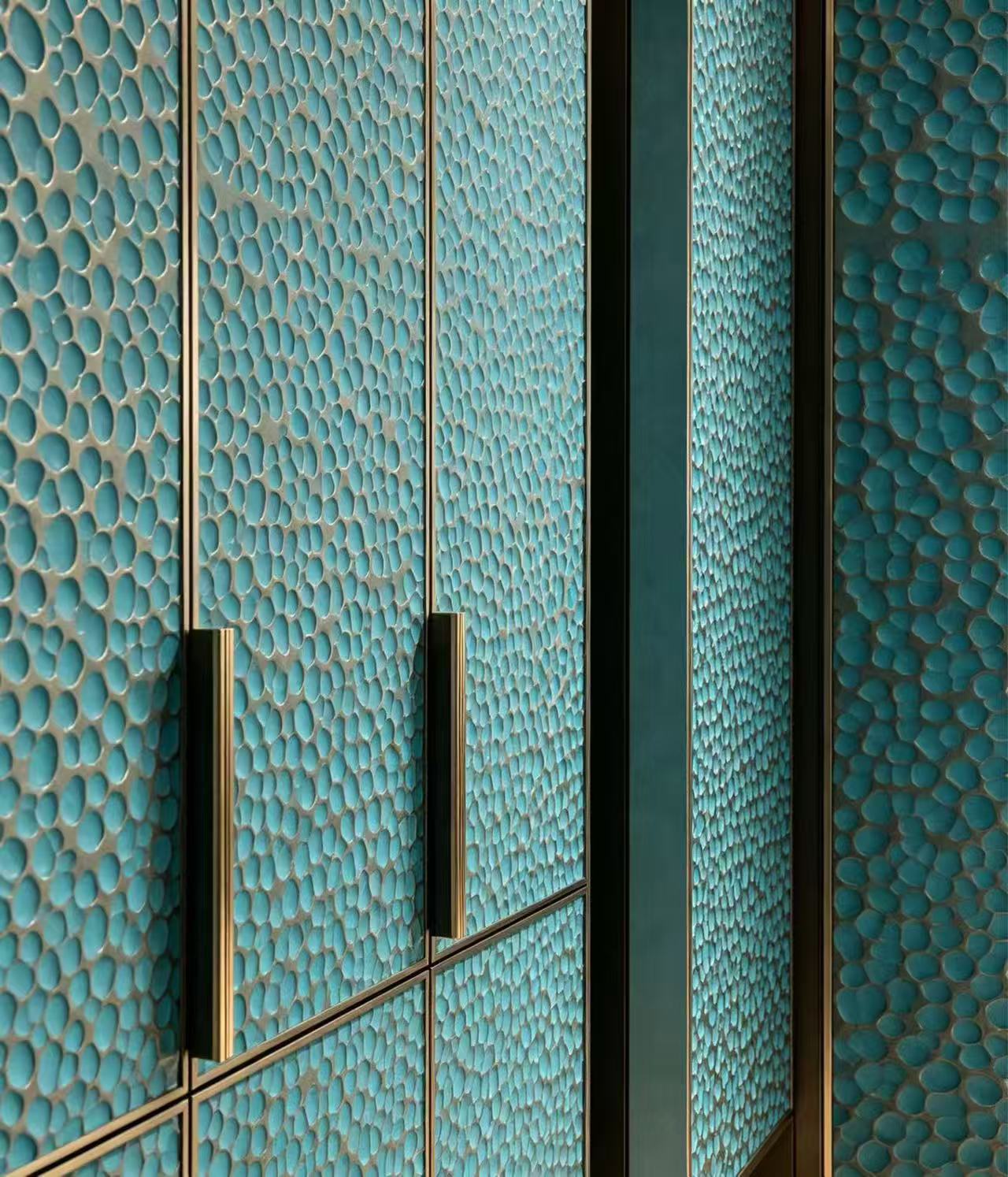 Teal pebble cladding closeup